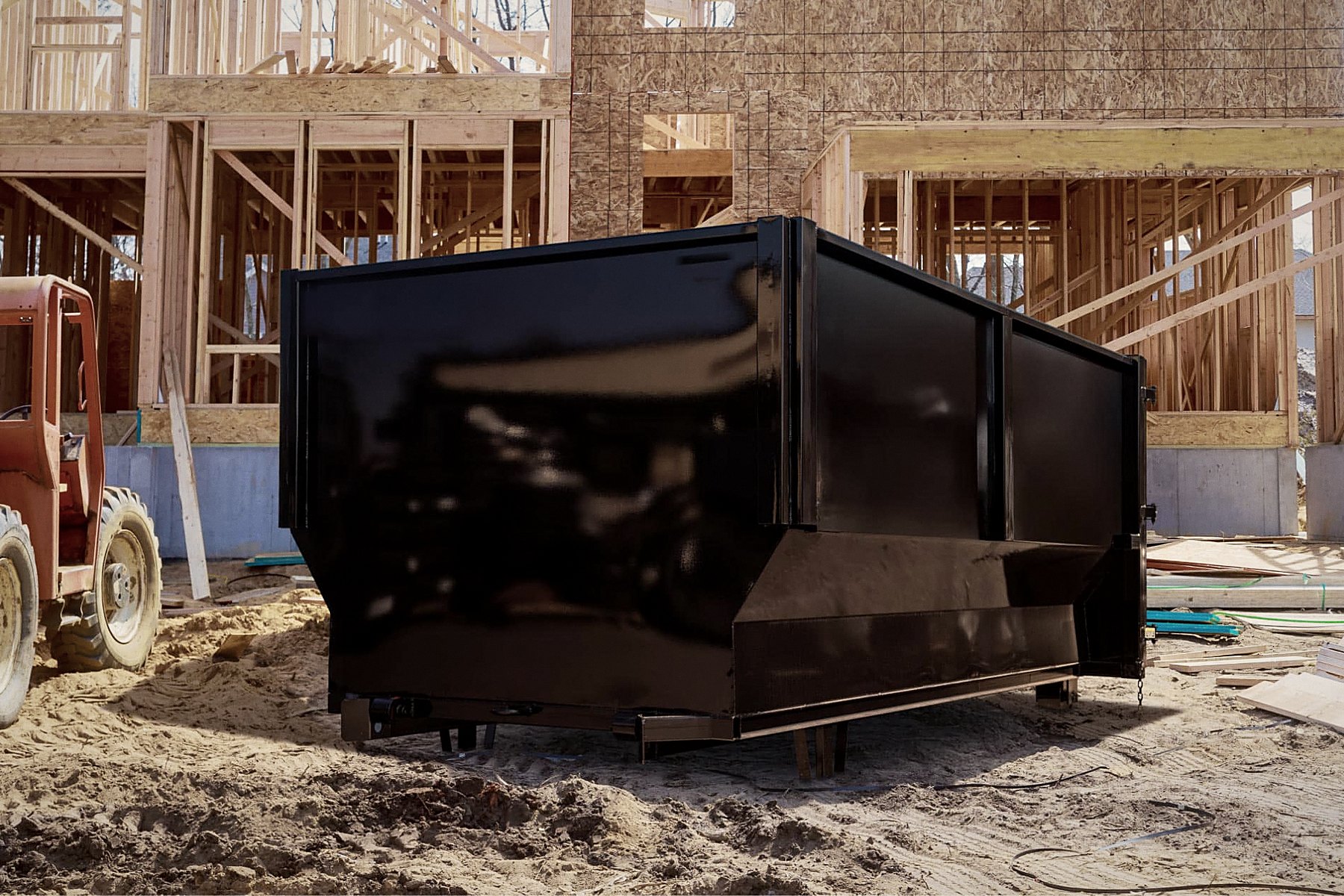 Roll-off dumpster set on a residential construction site